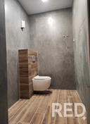 Выполнена укладка керамогранита с применением плиточного клея и затирки.