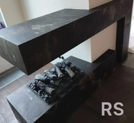 При отделке камина все элементы запилены и состыкованы под 45 градусов. Обработал поверхность защитной пропиткой. Швы аккуратно затерты специальным составом.