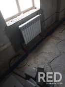 На фото монтаж радиаторов отопления под окном в столовой тёплого комбината, с подключением к центральной системе.