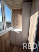 На фото произведен перенос розеток, утепление балкона, после чего отделка ламинатом и монтаж шкафа по индивидуальным размерам.